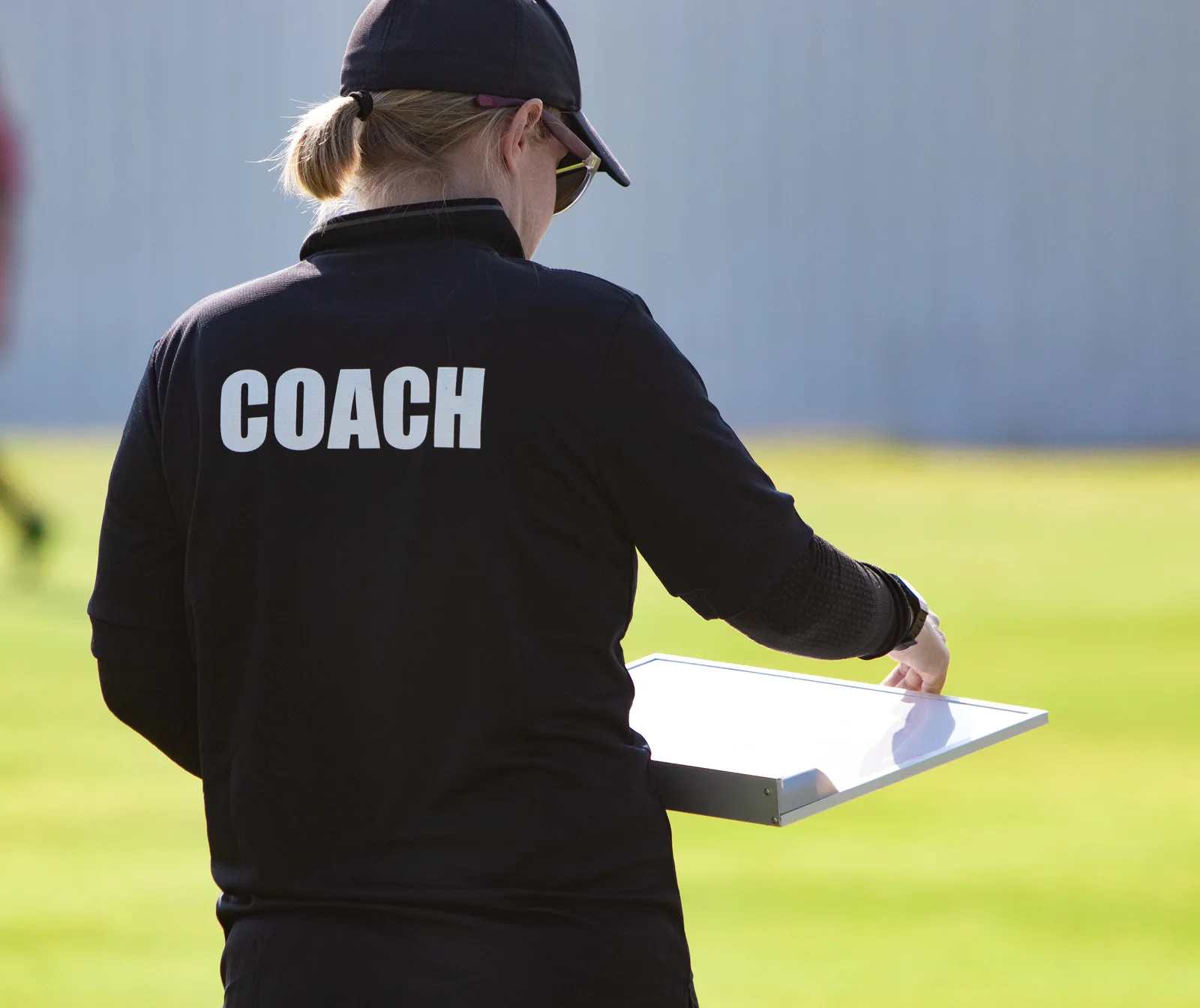Athlete training alone on a field, illustrating the gap in access to personalized sports coaching